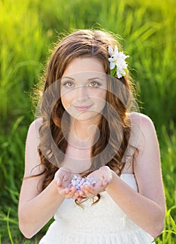 Beautiful girl smiling at the meadow