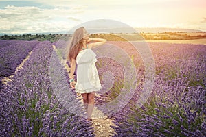 Beautiful girl smiling sunlight in lavender field