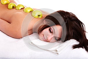 Beautiful girl on spa resort. Fruit massage.