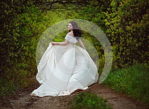 Beautiful girl spring walk in the woods