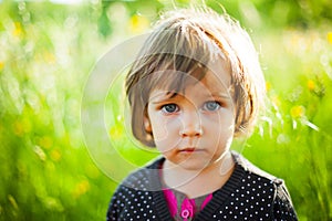 Beautiful girl standing in grass