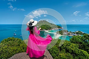 Beautiful girl standing on viewpoint at Koh Nangyuan island near Koh Tao island, Surat Thani in Thailand