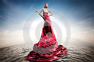 Beautiful girl standing on water