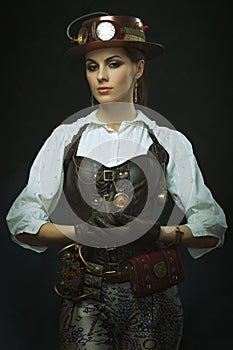 Beautiful girl steampunk. Posing with the clock