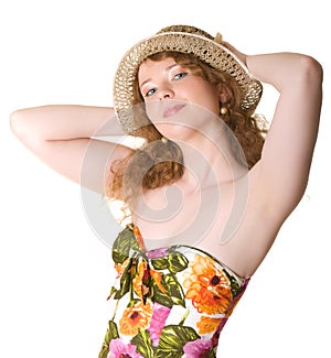 Beautiful girl in a straw hat