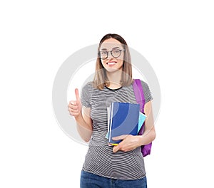 Beautiful girl student with a backpack holds notebooks in hands isolated on a white background