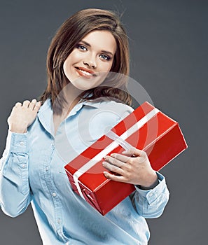 Beautiful girl student hold red gift box.