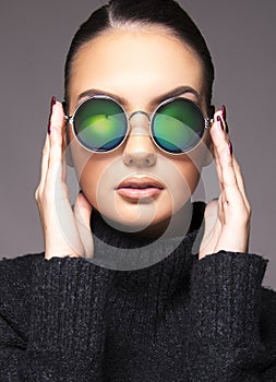 Beautiful girl with summer sunglasses and eye wear close up commercial concept