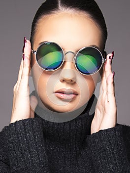 Beautiful girl with summer sunglasses and eye wear close up commercial concept