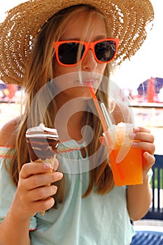 Beautiful girl in sunglasses, ice, slush on beach