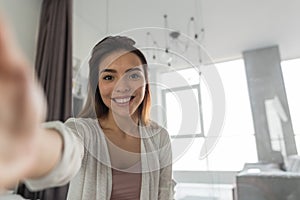 Beautiful Girl Taking Selfie Portrait Photo In Bedroom In Morning