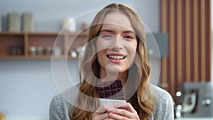 Beautiful girl tasting chocolate indoors. Smiling woman enjoying dark chocolate