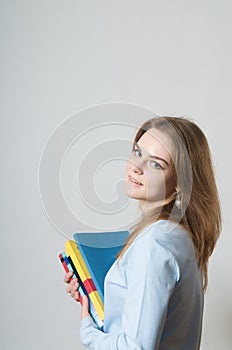 Beautiful girl with textbooks