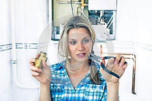 Beautiful Girl Is Trying To Repair a Boiler