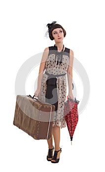 Beautiful girl with umbrella and old suitcase