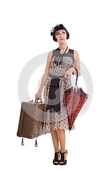 Beautiful girl with umbrella and old suitcase