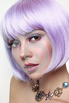 Beautiful girl with violet hair and fancy make-up