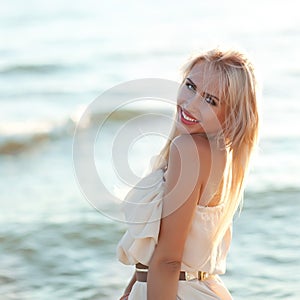 Beautiful girl walking down the beach