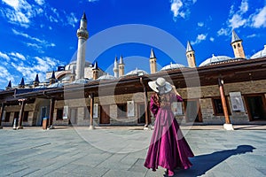 Beautiful girl walking at mosque in Konya, Turkey. photo