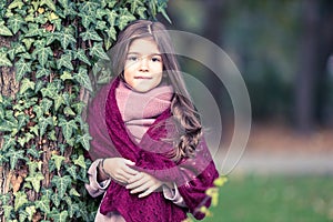 Beautiful girl with warm fluffy scarf