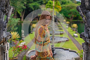 Beautiful girl in the water temple of Inlonesia. Bali