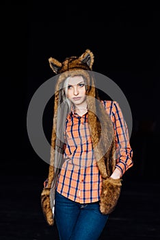 Beautiful girl wearing brown fur hat