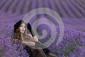 Beautiful girl is wearing fashion dress at field of lavender