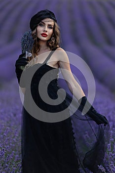 Beautiful girl is wearing fashion dress at field of lavender