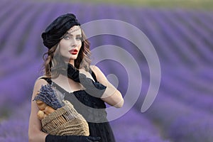 Beautiful girl is wearing fashion dress at field of lavender