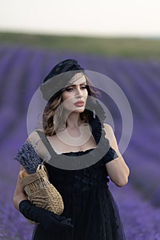 Beautiful girl is wearing fashion dress at field of lavender