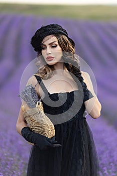 Beautiful girl is wearing fashion dress at field of lavender