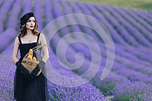 Beautiful girl is wearing fashion dress at field of lavender