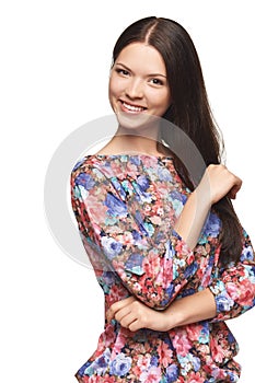 Beautiful girl wearing floral shirt standing playfully