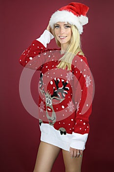 Beautiful girl wearing a kitsch Christmas sweater