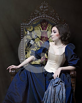 Beautiful girl wearing a medieval dress. Studio works inspired by Caravaggio. Cris. XVII photo