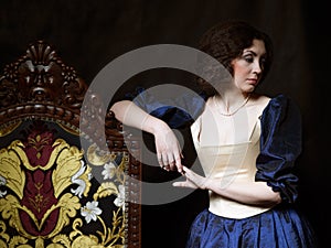 Beautiful girl wearing a medieval dress. XVII photo