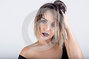 Beautiful girl with wet hair on a white background