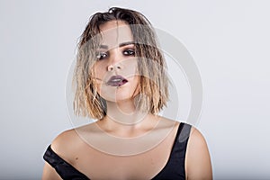 Beautiful girl with wet hair on a white background