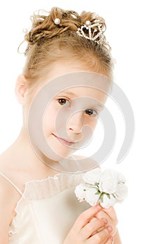 Beautiful girl in white dress with a flower