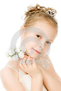 Beautiful girl in white dress with a flower