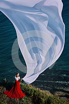 Beautiful Girl With White fabric on sea background