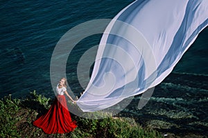 Beautiful Girl With White fabric on sea background