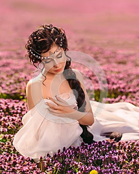 A beautiful girl in a white vintage dress