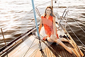 A beautiful girl in a white yacht in the ocean.