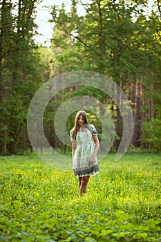 Beautiful girl among the wild flowers