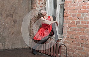 Beautiful girl on a window sill