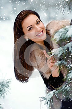 Beautiful girl in winter forest