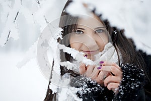 Beautiful girl in winter forest