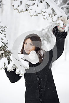 Beautiful girl in winter forest