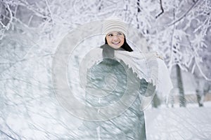 Beautiful girl in winter forest